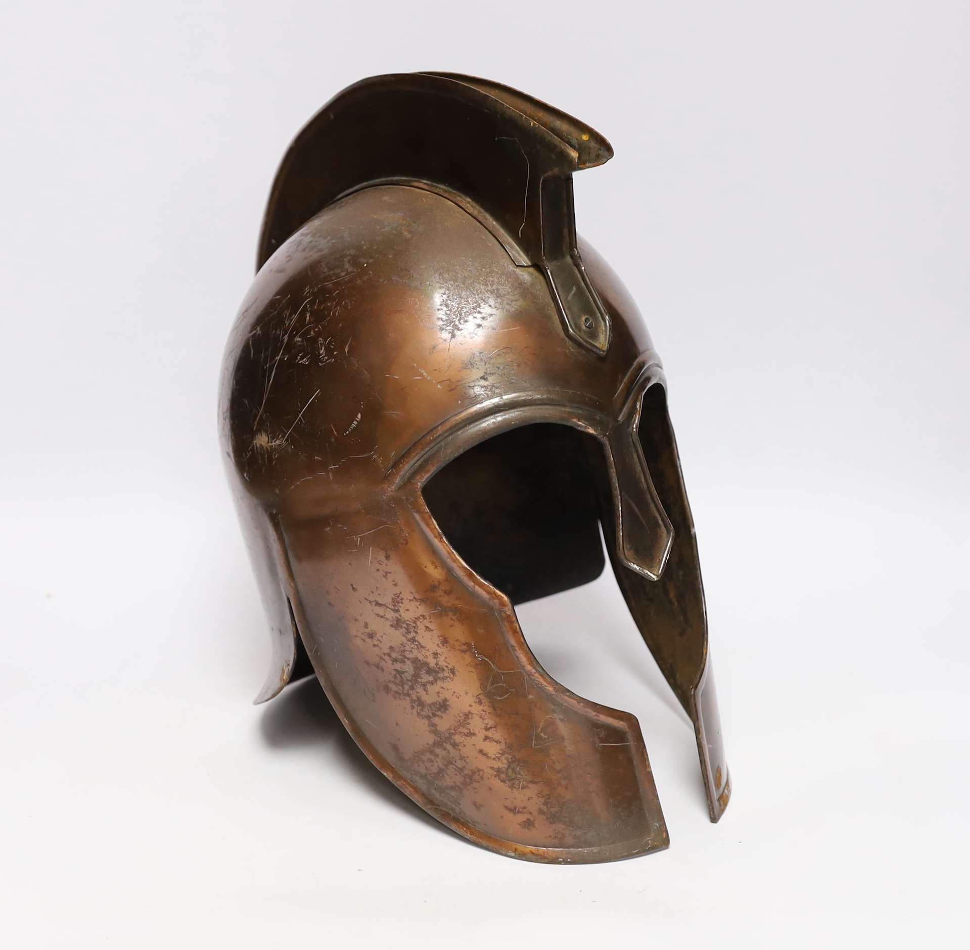 A copper gladiator's helmet, 32cm high